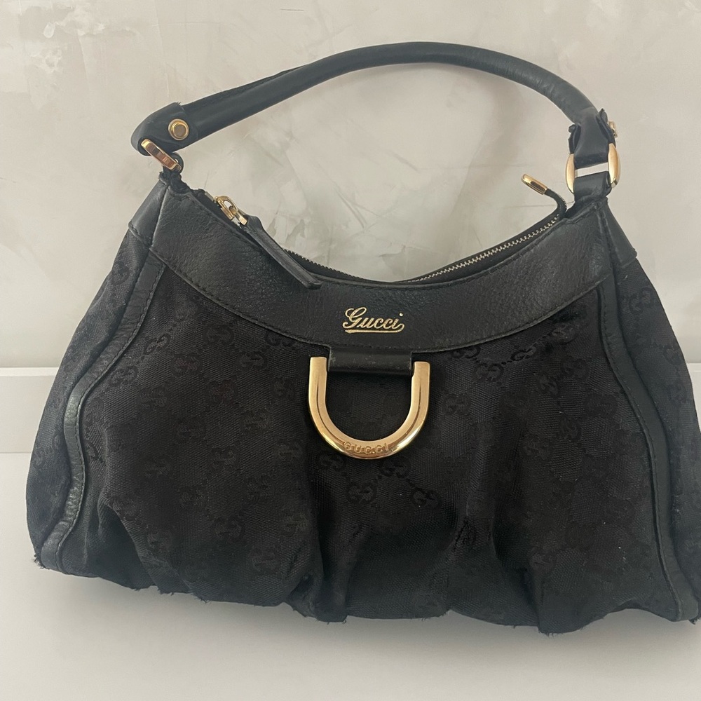 GUCCI
Black GG Canvas Gold D Ring Hobo Bag